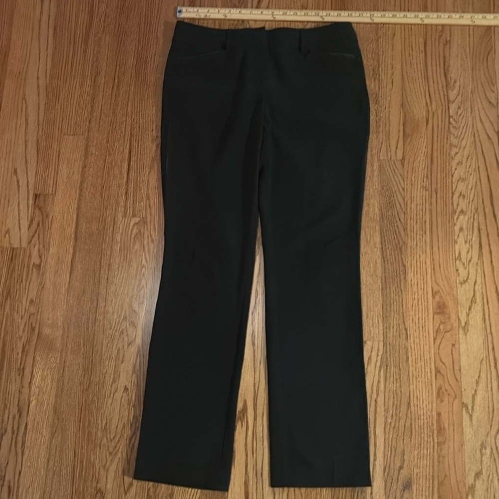Black pants with ribbon trim on pockets